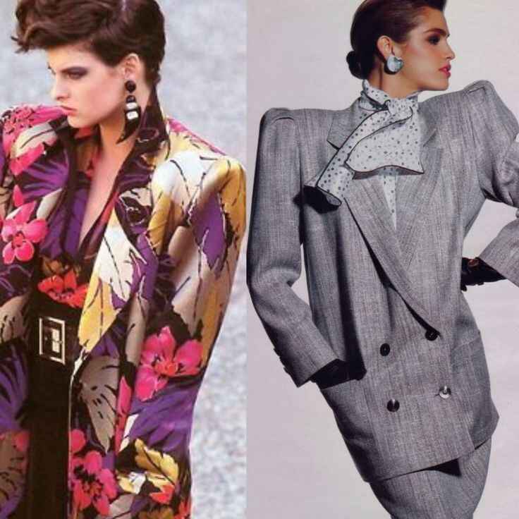 Two models wearing oversized, padded shoulder blazers in bold patterns and pastel colors, representing 80s fashion trends