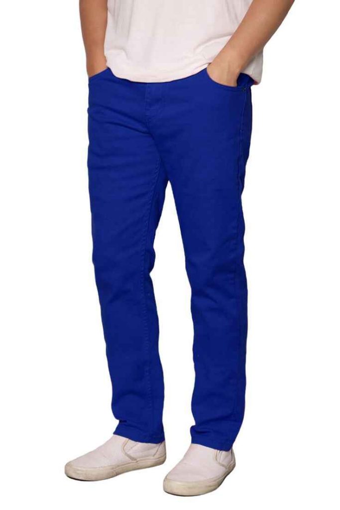 Men's vibrant royal blue slim chinos paired with white slip-on shoes.